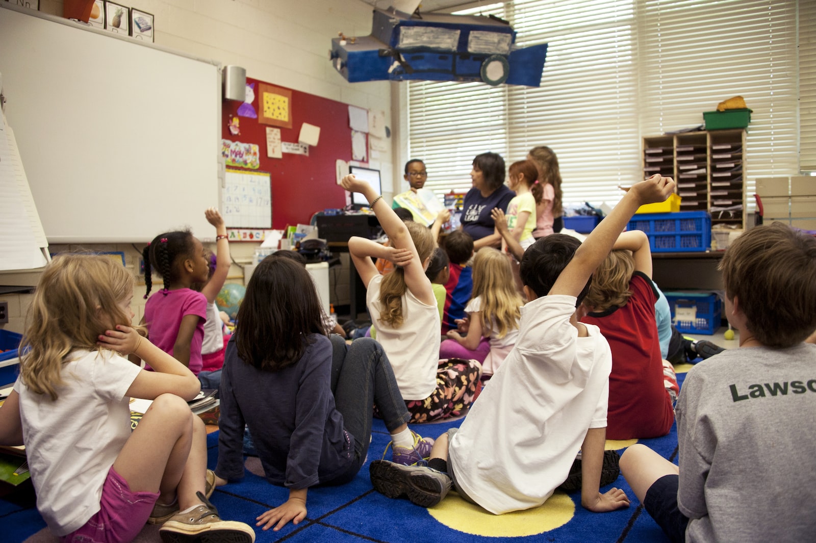 Class of preschoolers answering a question