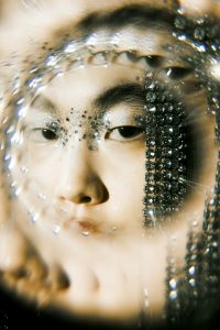 hyperfocus on the sparkly face of a woman