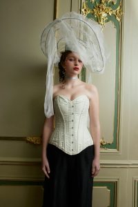 Woman dressed in fancy fabrics looking like 18th century royalty